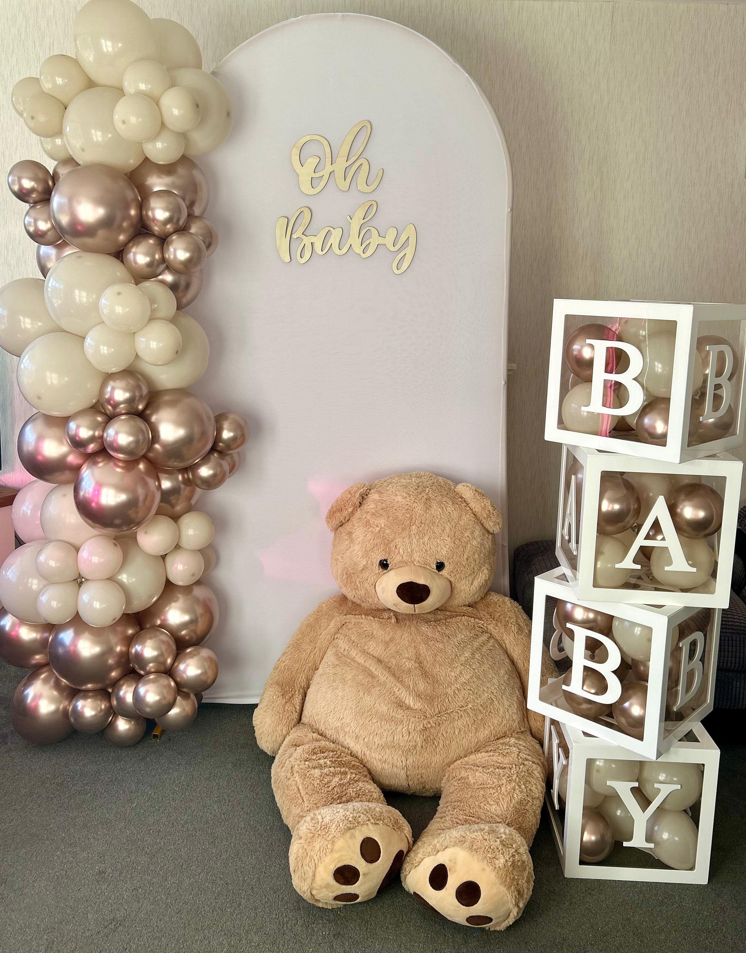 Oh Baby balloon backdrop with balloon letter boxes and a teddy bear