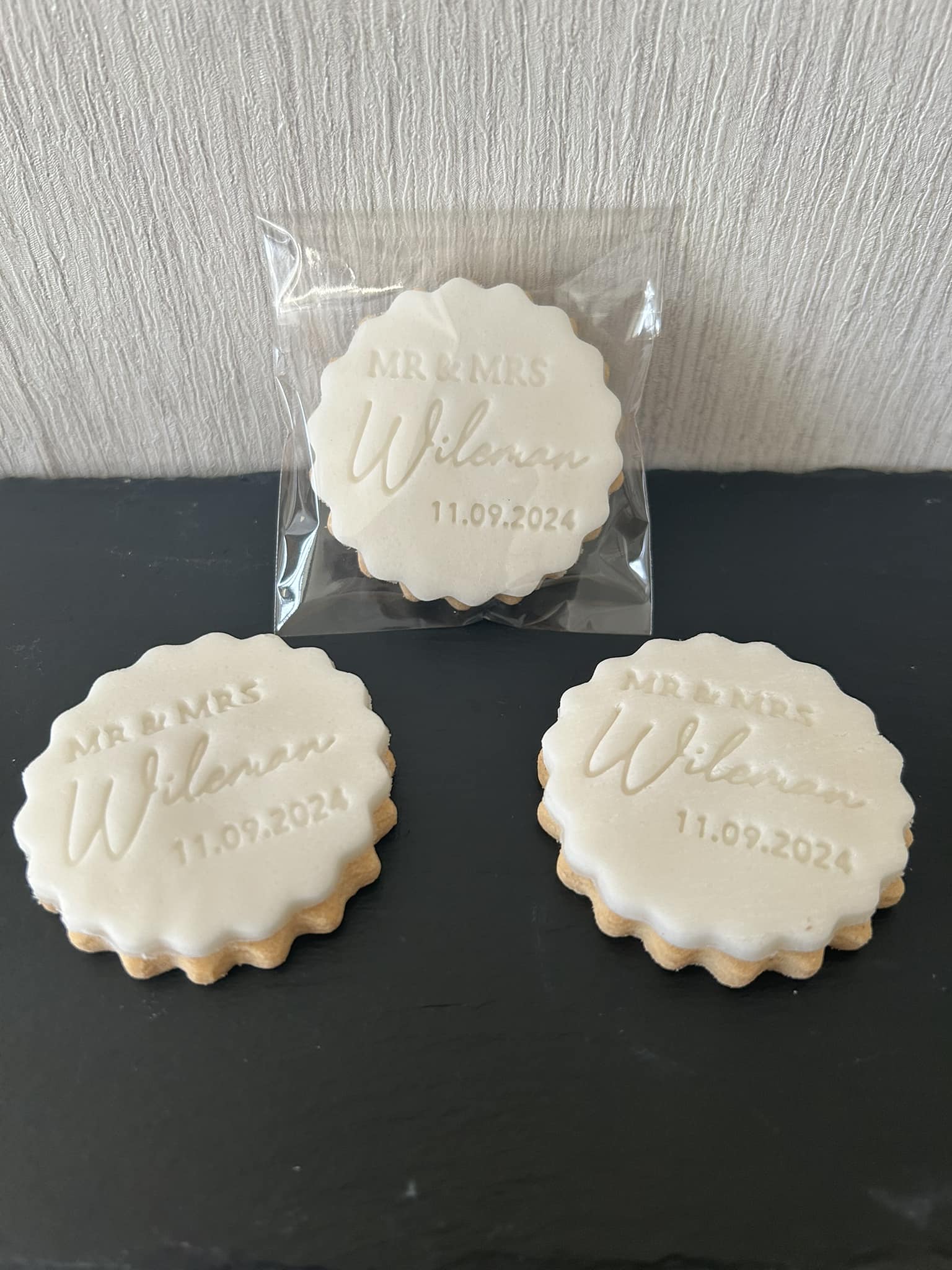 Personalised iced biscuits reading Mr and Mrs Wileman