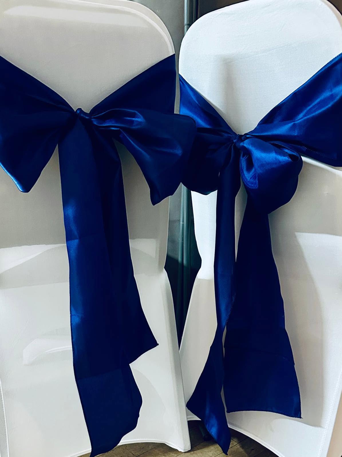 Chair covers with navy blue bow sashes